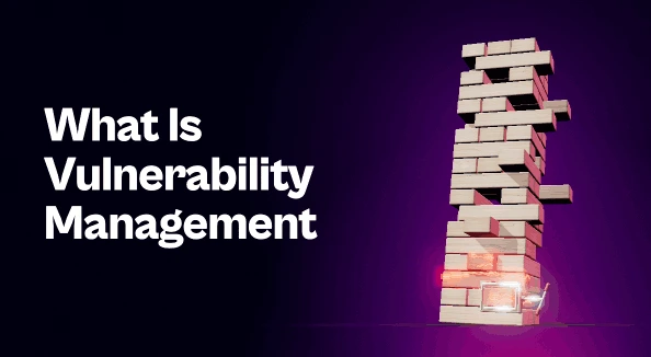 Leaning block tower with red-glowing cracked blocks near the base, one held by a steel clamp, beside the title "What Is Vulnerability Management".